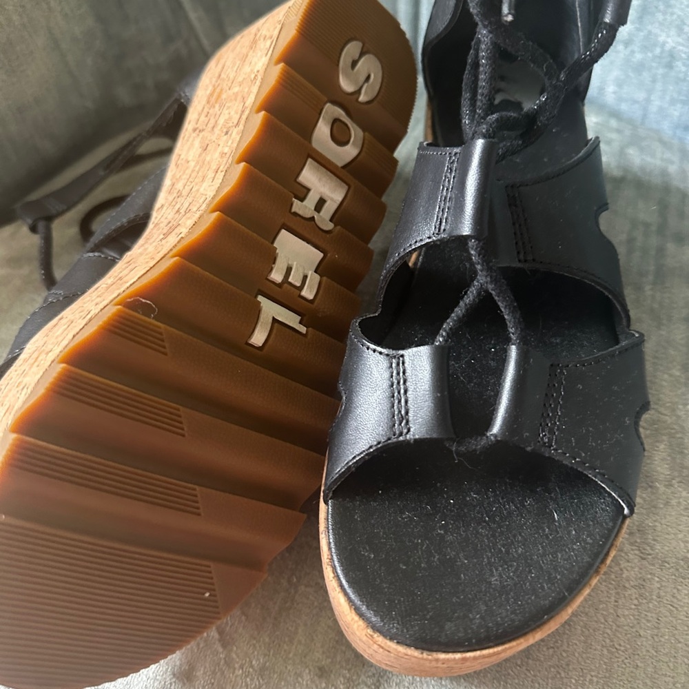 Sorel Black Sandals with Leather Strap and Brown Sole